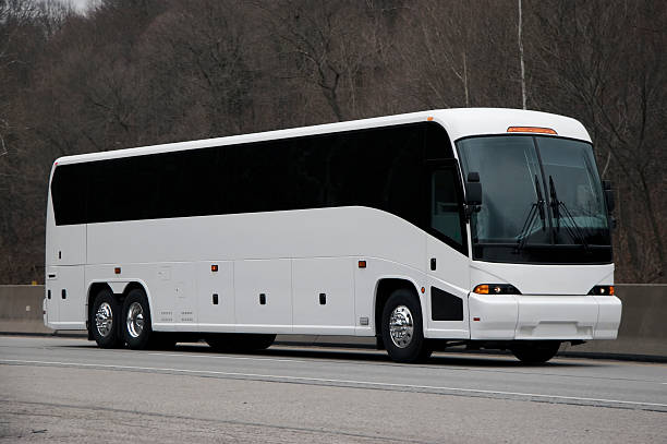 White Tour or Charter Bus on Highway.  Could Also Be Expensice Luxury RV